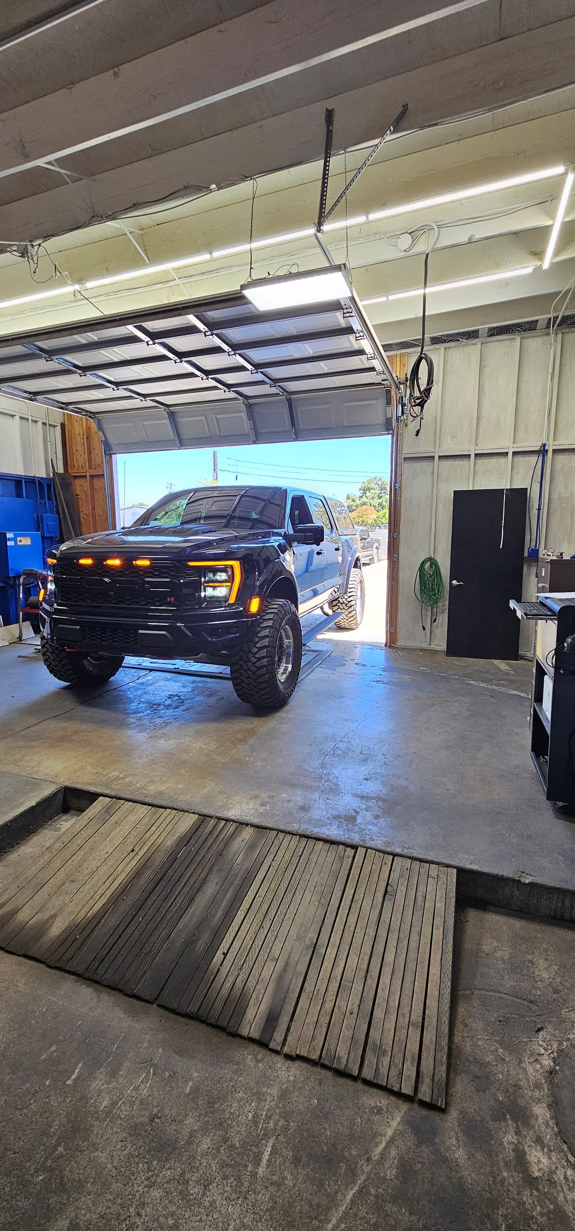 Professional smog check technician performing emissions testing